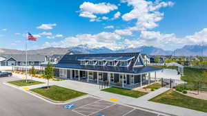 View of property featuring a residential view, fence, a mountain view, and uncovered parking