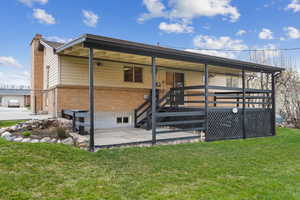 Back of house with  a deck