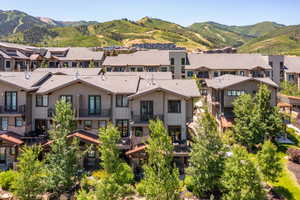 Aerial perspective of suburban area featuring a mountainous background