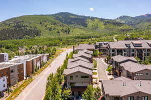 Aerial view of residential area featuring mountains