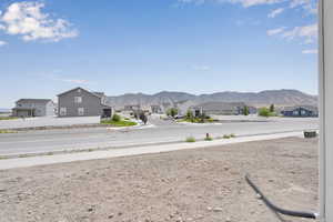 View of asphalt street featuring a mountain view and a residential view