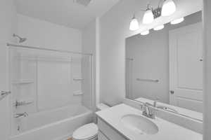 Full bath featuring shower / bathtub combination and vanity