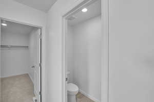Bathroom featuring baseboards and recessed lighting