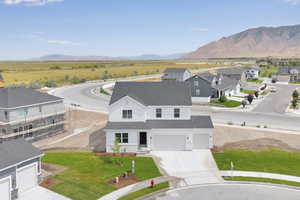 Aerial perspective of suburban area featuring a mountainous background
