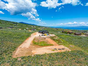 View of subject property featuring a mountainous background