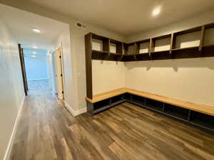 Mudroom with dark wood-style flooring and recessed lighting