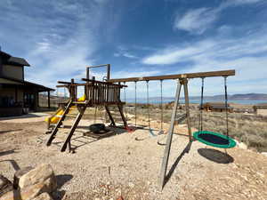 View of jungle gym with a mountain view