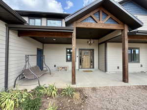 Back of property featuring a patio area