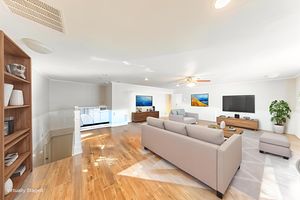 Living room featuring light wood finished floors and ornamental molding