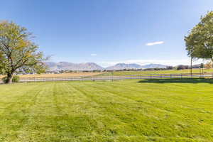 View of yard with a mountain view and a view of rural / pastoral area