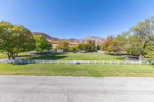 View of mountain backdrop with rural landscape and a pastoral area