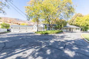 Ranch-style home with driveway and an attached garage