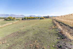 View of yard with a view of countryside and a mountain view