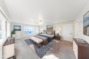 Bedroom featuring light carpet and a ceiling fan