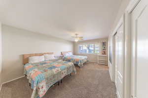 Bedroom featuring carpet flooring and a ceiling fan