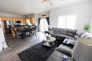 Living area featuring light wood-style flooring, recessed lighting, and ceiling fan