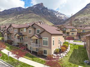 Property view of mountains with a residential view