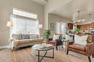 Living room with light carpet and baseboards