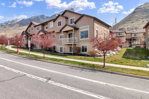 View of property with a residential view and a mountain view