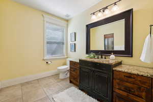 Bathroom with tile patterned flooring and a stall shower