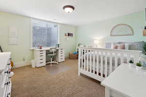 Bedroom featuring carpet and a huge walk-in closet.