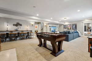 Rec room with carpet floors, and recessed lighting
