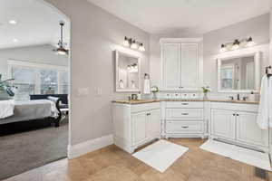 Primary Ensuite Bathroom with ensuite bathroom, double vanity, a sink, and a ceiling fan