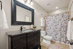 Full bathroom with tile patterned flooring and vanity