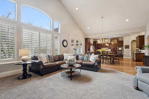 Living area open to breakfast area, kitchen and large windows with mountain views. Walk out onto the covered porch...