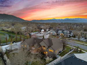Aerial view at dusk featuring a mountain view and a residential view