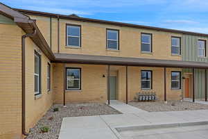 View of property with brick siding