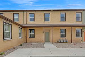 View of front facade featuring brick siding