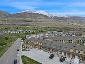 Drone / aerial view with a residential view and a mountain view