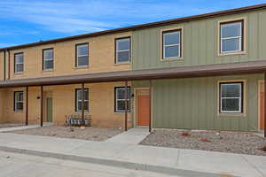 Townhome / multi-family property with brick siding