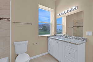 Full bath with baseboards, toilet, vanity, tiled shower, and marble finish floor
