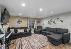 Living area featuring recessed lighting and wood finished floors