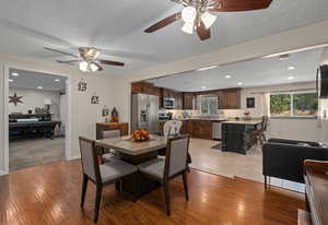 Dining room with recessed lighting, wood finished floors, and ceiling fan