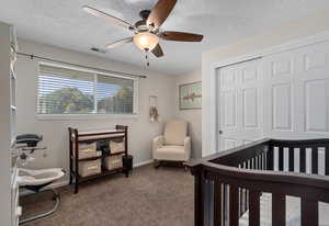 Bedroom featuring ceiling fan, a closet, carpet flooring, and baseboards