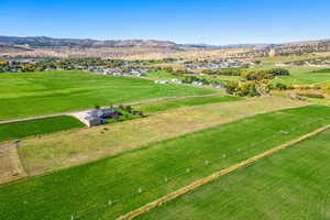 Birds eye view of property with a mountain view and a rural view
