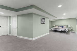 Bedroom with baseboards, recessed lighting, and carpet