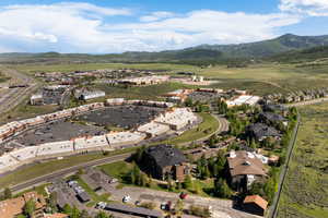 Aerial overview of property's location with a mountainous background