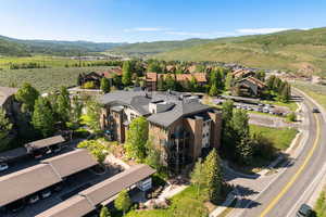 Aerial view of residential area featuring a mountainous background