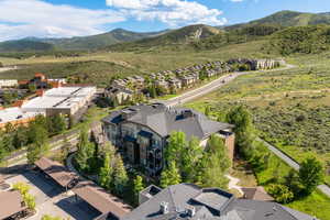 Aerial perspective of suburban area featuring a mountainous background