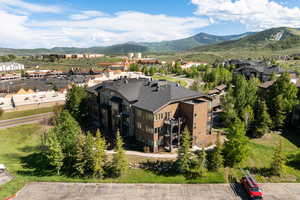 Aerial view of residential area featuring a mountainous background