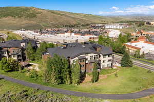 Aerial perspective of suburban area with a mountainous background