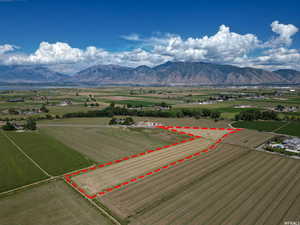 Birds eye view of property with a rural view and a mountain view