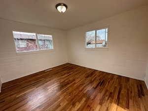 Spare room with wood finished floors