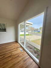 Unfurnished sunroom featuring visible vents