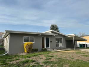 View of front of home with a carport