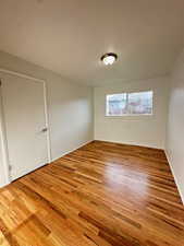 Unfurnished room with wood finished floors